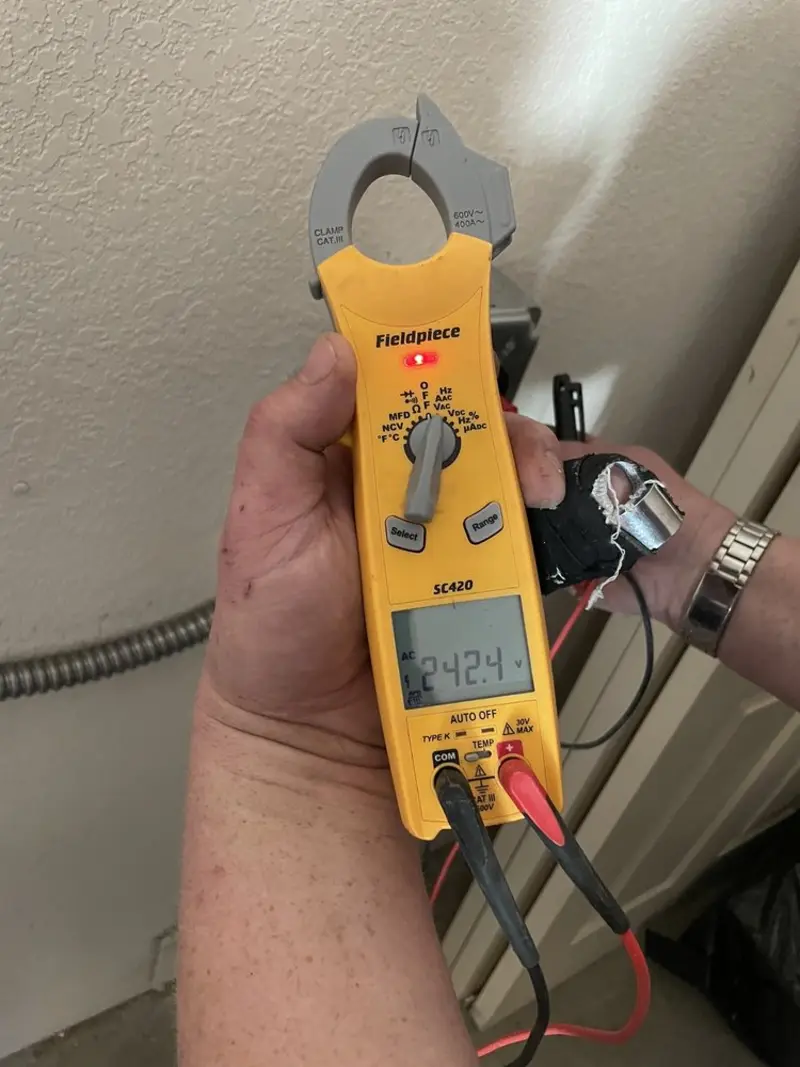 Voltage testing with clamp meter during Electrical Installation Services in Matawan
